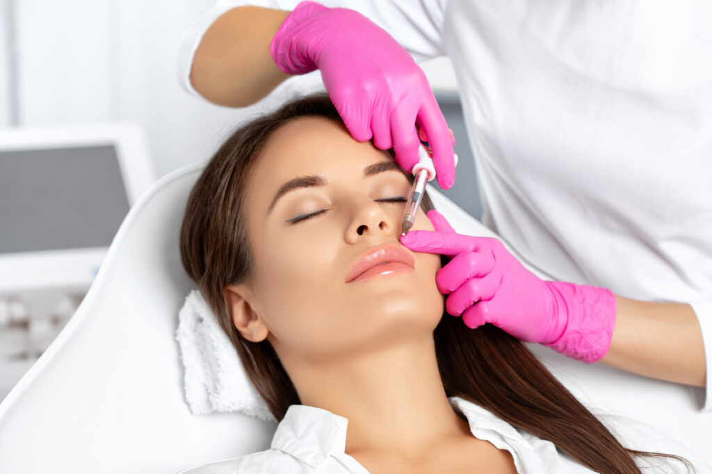 Beautiful Woman tacking injection on her face | Jennmarie Medspa in Schaumburg, IL