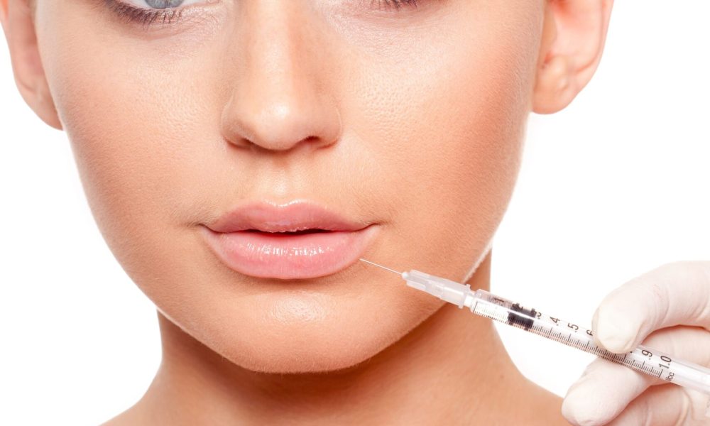A Beautiful lady getting injection on lip | Lip fillers in Schaumburg, IL | JennMarie Medspa